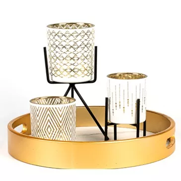 Ylellisyyskuvio lasikynttilän pidike