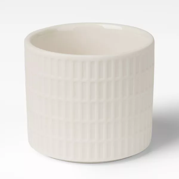 Maidonvalkoinen ristikkokuvioiset keraamiset kynttilänjalat Maidonvalkoinen ristikkokuvioiset keraamiset kynttilänjalat