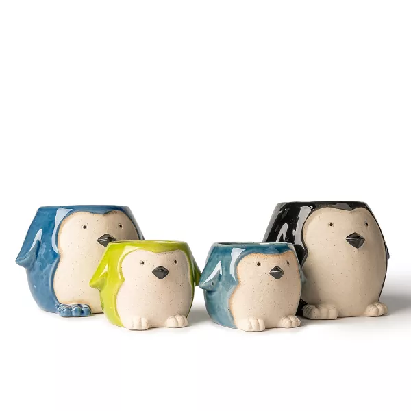 Pingviinin muotoiset keraamiset kynttilänjalat