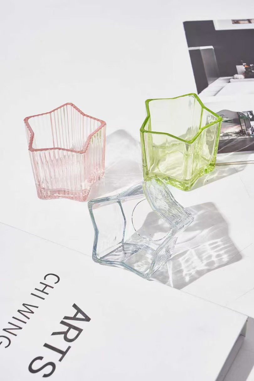 Tähtien muotoinen lasikynttiläpidike